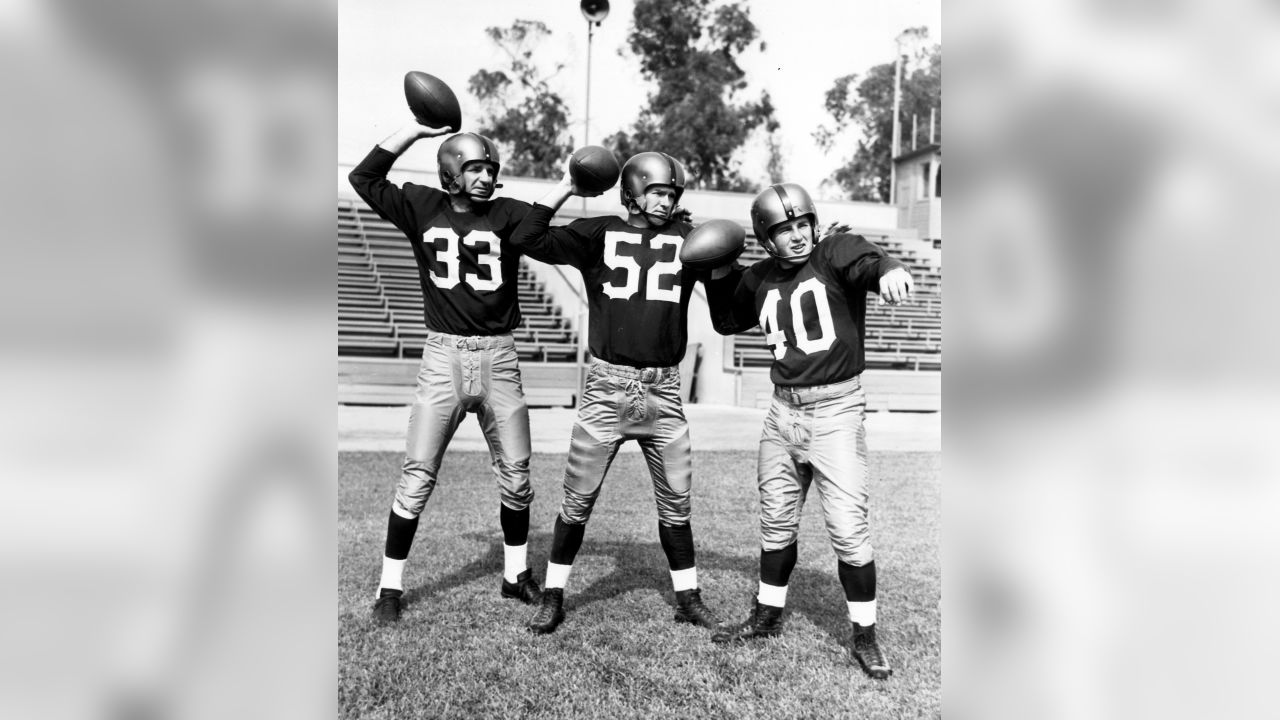 Sammy Baugh chuckles on the bench over a yarn told by Harry Wismer News  Photo - Getty Images