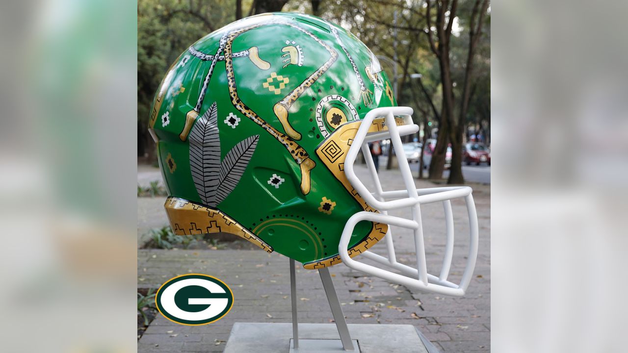 Artists take on all 32 NFL team helmets