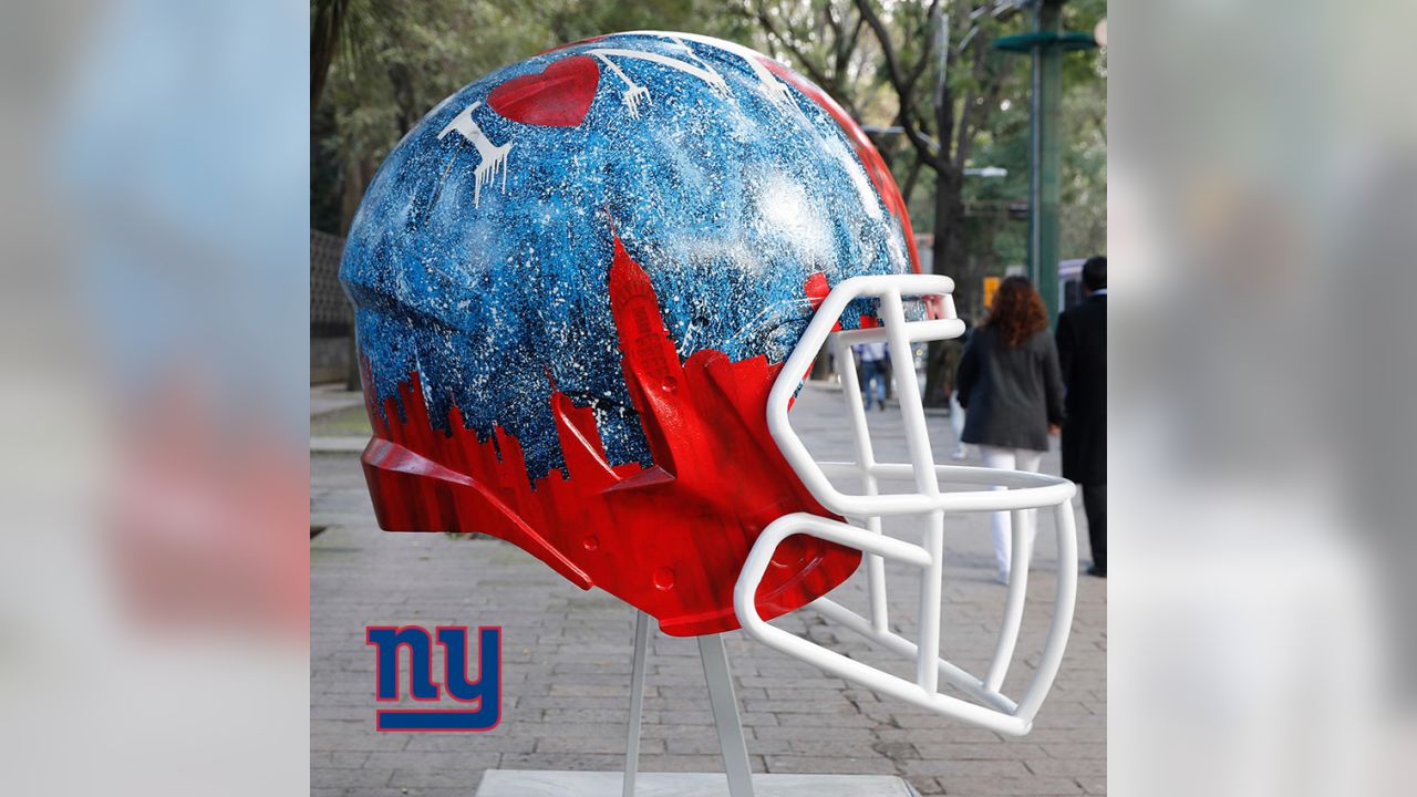 Artists take on all 32 NFL team helmets