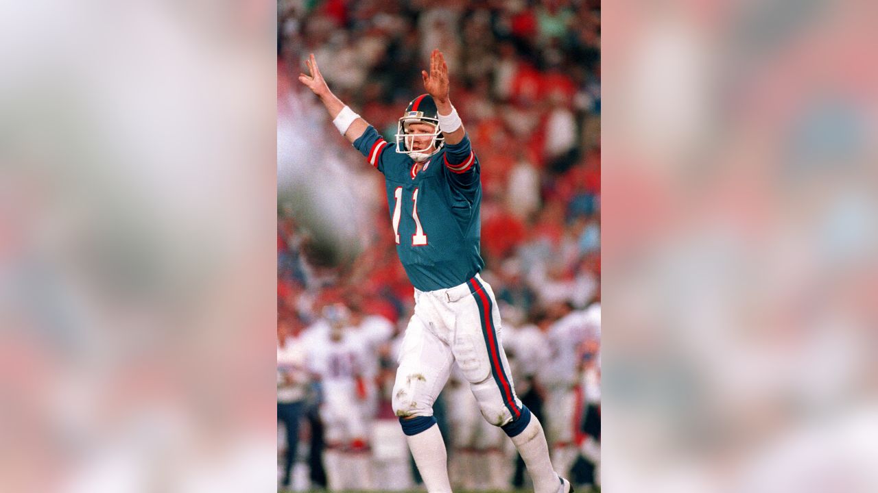 Quarterback Phil Simms of the New York Giants drops back to pass