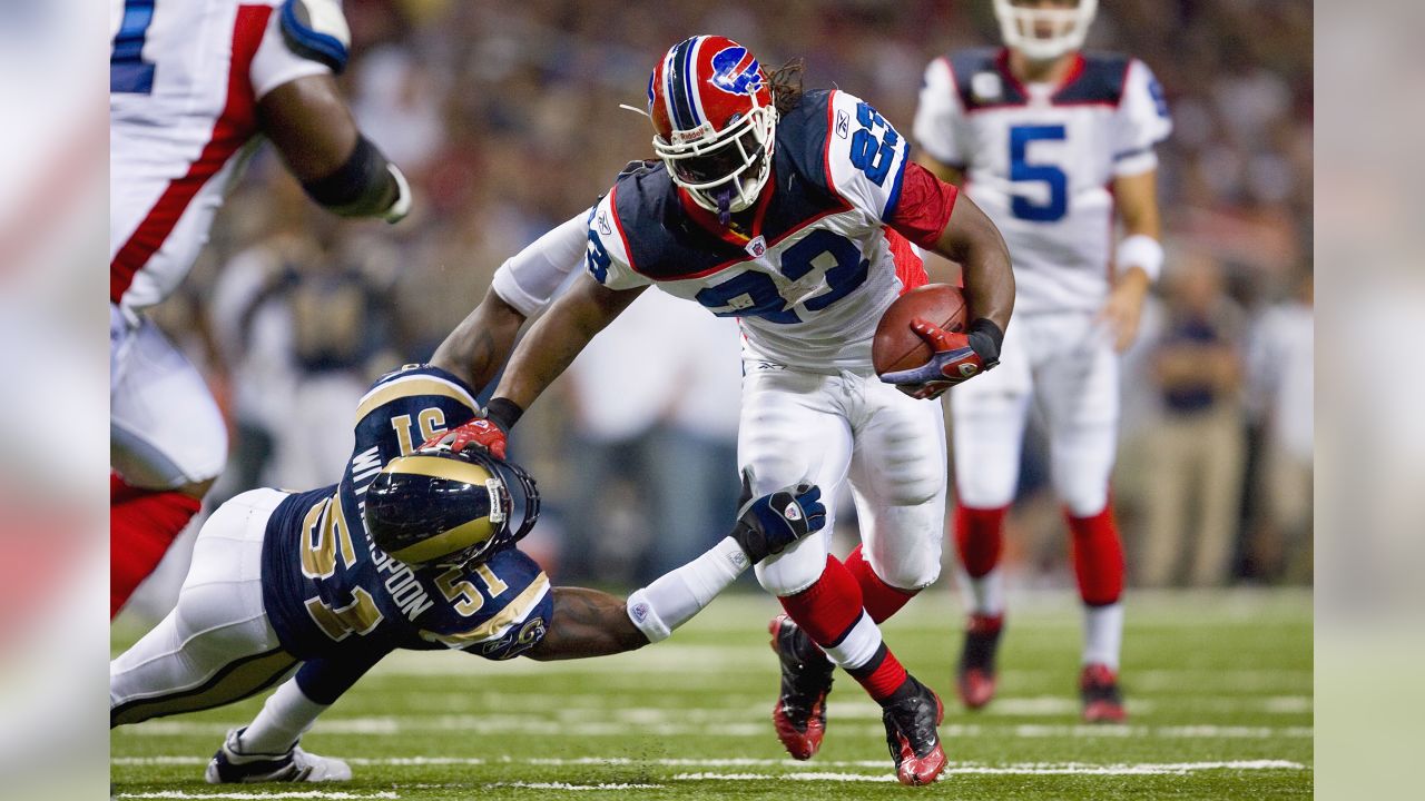 Steven Jackson of the St. Louis Rams is tackled by Aaron Schobel of News  Photo - Getty Images