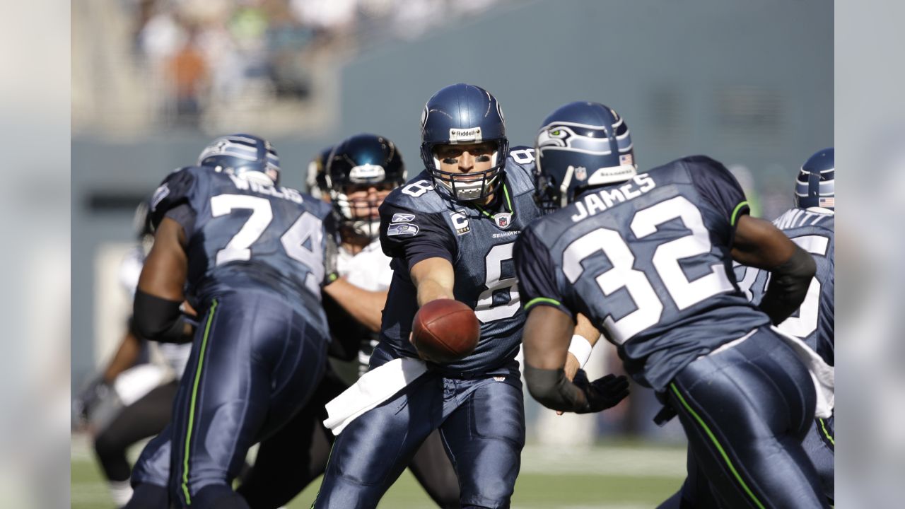 Seattle Seahawks' T.J. Houshmandzadeh, left, celebrates a touchdown  reception as Deion Branch looks on during the first half of an NFL football  game against the Jacksonville Jaguars, Sunday, Oct. 11, 2009, in