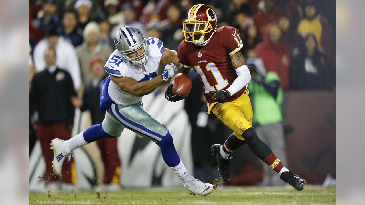 Dallas Cowboys quarterback Matt Cassel (16) walks off the field after  leading his team to a 19-16 victory over the Washington Redskins at FedEx  Field in Landover, Maryland on Monday, December 7