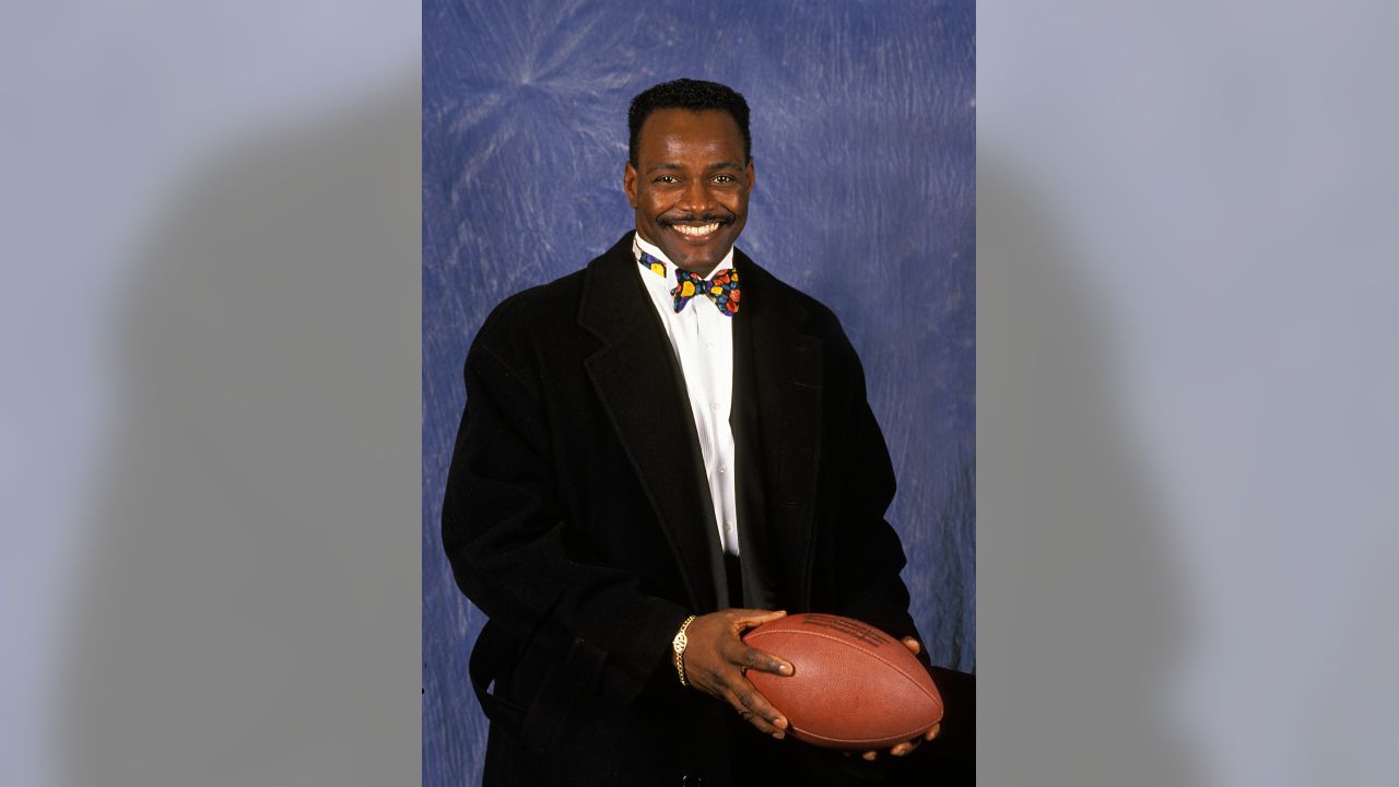 Standing infront of a wreath bearing Walter Payton's jersey number, Eddie  Payton, older brother of the late NFL Hall of Fame runningback Walter Payton,  thanks the audience attending Walter's memorial service Monday