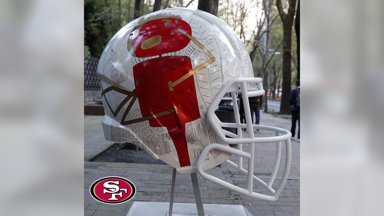 Artists take on all 32 NFL team helmets