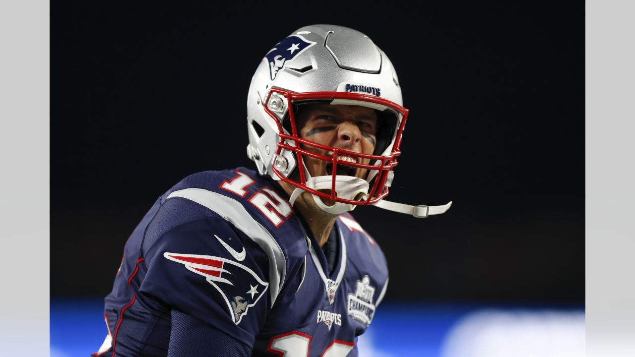 A member of the New England Patriots wears a sweatshirt with the crucial  catch logo during overtime of an NFL football game against the Dallas  Cowboys, Sunday, Oct. 17, 2021, in Foxborough