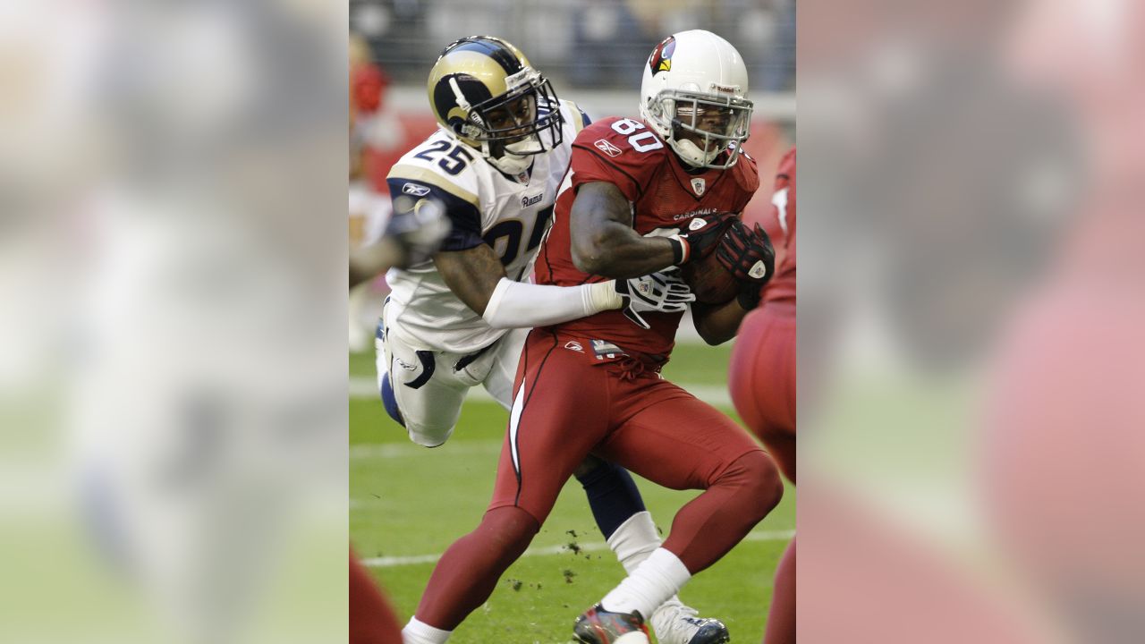 Arizona Cardinals Anquan Boldin slips a tackle by St. Louis Rams