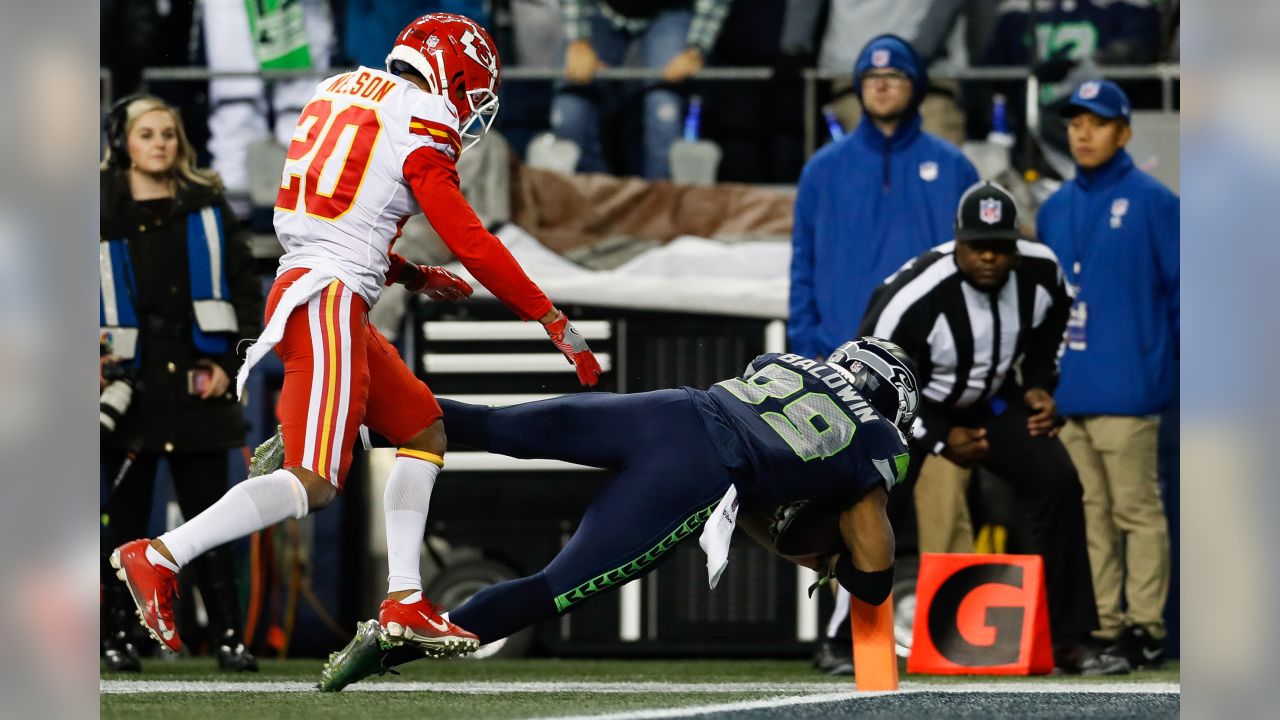 Seattle Seahawks tight end Nick Vannett (81) celebrates with a fan after he  scored a touchdown against the Kansas City Chiefs during the first half of  an NFL football game, Sunday, Dec.