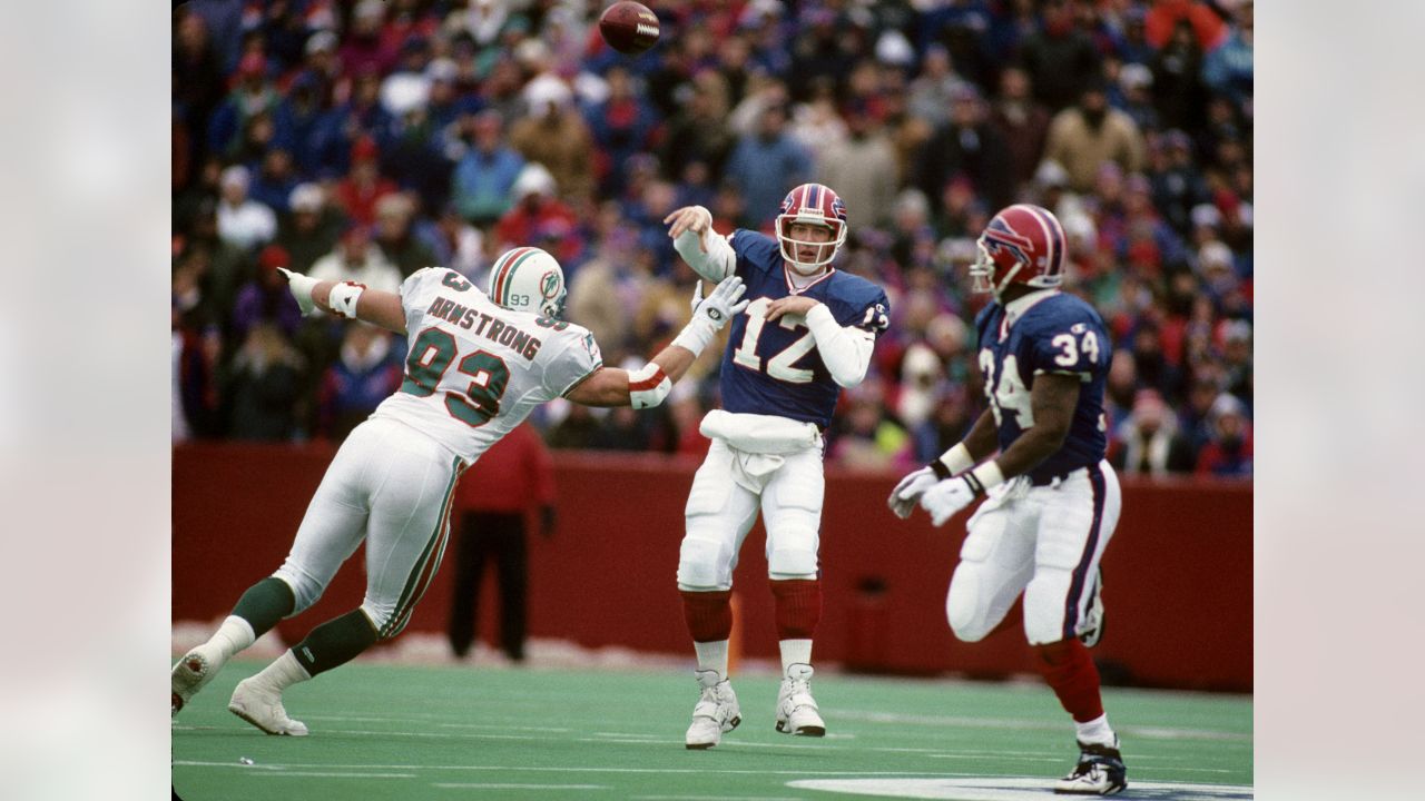 Miami Dolphins running back Patrick Cobbs (38) picks up 30 yards on this  catch against the Baltimore Ravens in first quarter action in the NFL AFC wildcard  game at Dolphin Stadium in