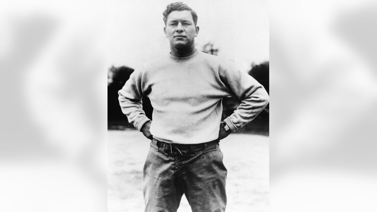 Coach E. L. (Curly) Lambeau (second from left) and his staff plan