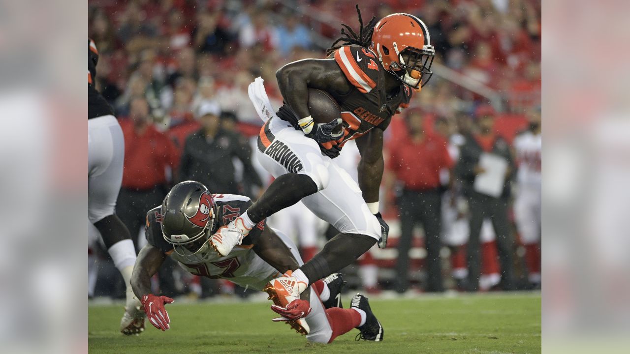 Cleveland Browns running back Terrence Magee (33) is stopped by