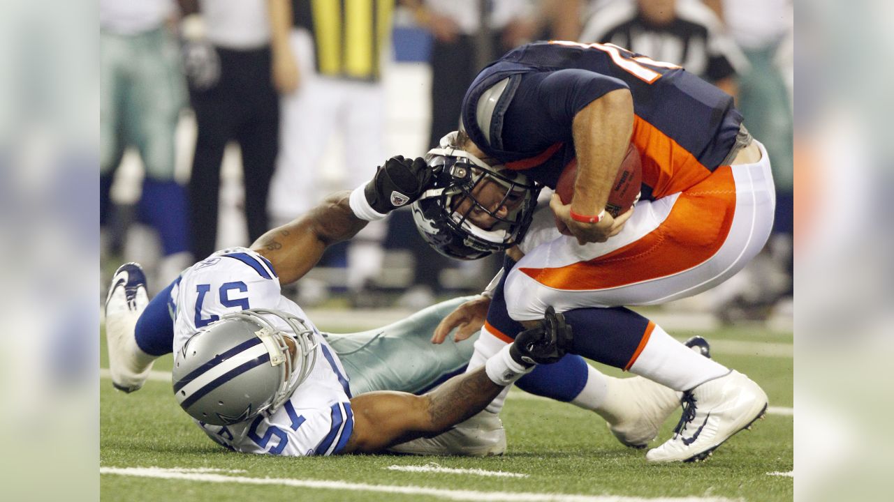 Dallas Cowboys linebacker Victor Butler tackles Miami Dolphins