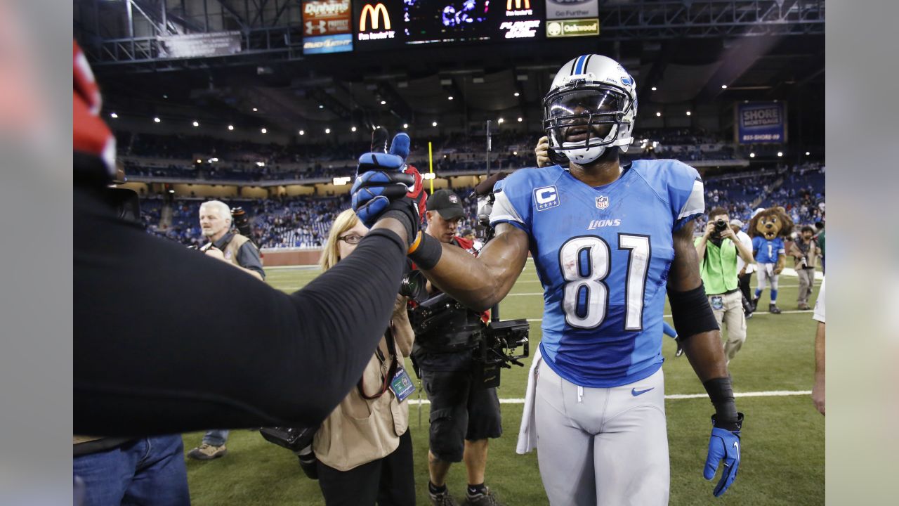 A Sandy Hook Elementary School pin is worn by a Detroit Lions assistant  coach before an NFL football game against the Atlanta Falcons at Ford Field  in Detroit, Saturday, Dec. 22, 2012. (