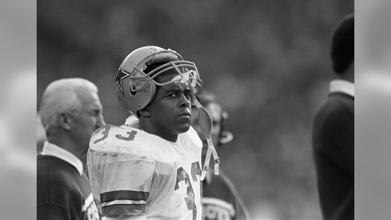 Tony Dorsett, Dallas Cowboys running back, second from left, gets