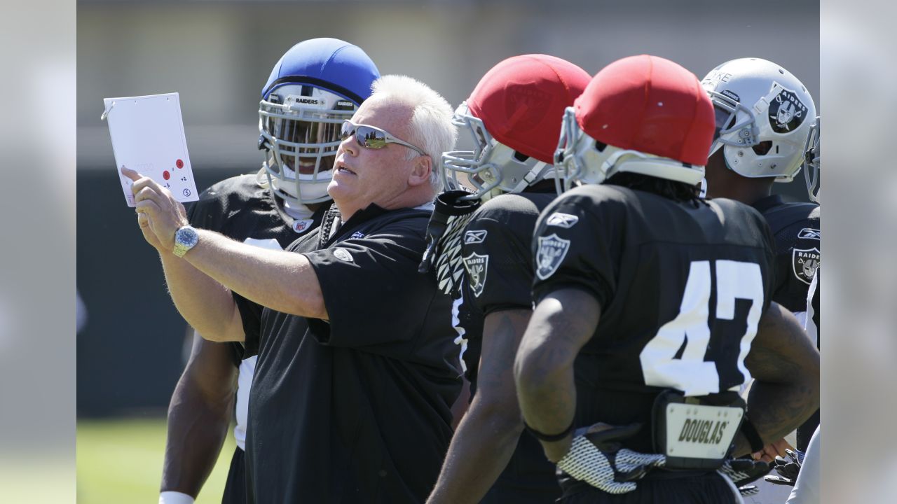 Oakland Raiders running backs Darren McFadden, left, and Rock Cartwright,  right, rest between drills during their NFL football training camp in Napa,  Calif., Thursday, July 28, 2011. (AP Photo/Eric Risberg Stock Photo 