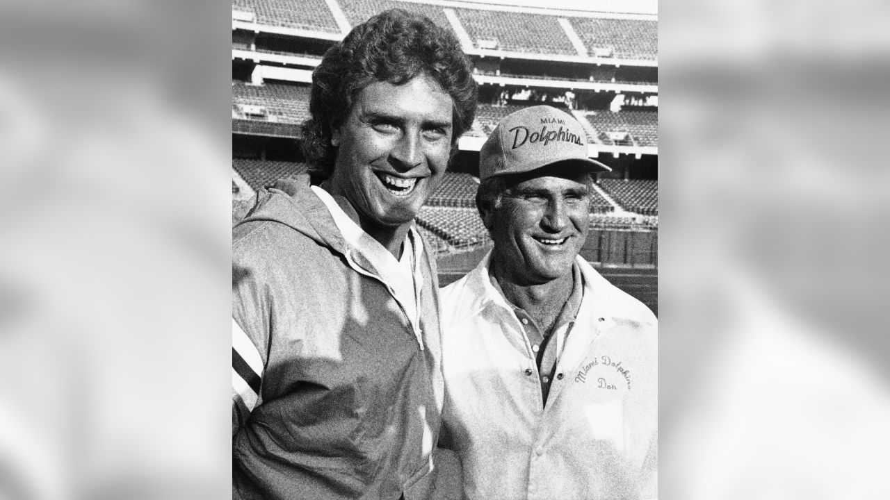 An August 15, 1995 file photo of Miami Dolphins' head coach Don Shula talks  with quarterback Dan Marino during practice at the team's training facility  in Davie, Fla. Six years after the