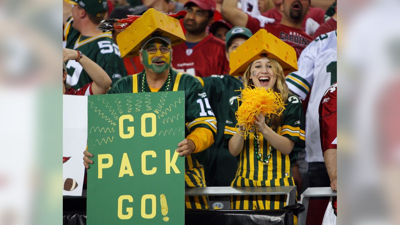 Green Bay Packers fans wear cheese hats while Buffalo Bills fans