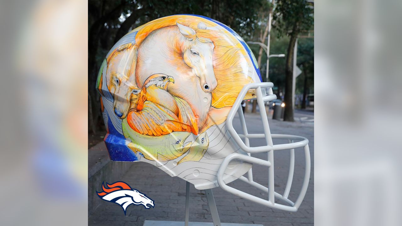 Artists take on all 32 NFL team helmets