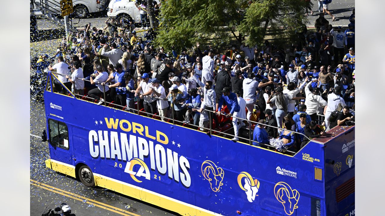 Buses carrying Los Angeles Rams players and coaches drive past fans during  the team's victory parade in Los Angeles, Wednesday, Feb. 16, 2022,  following their win Sunday over the Cincinnati Bengals in