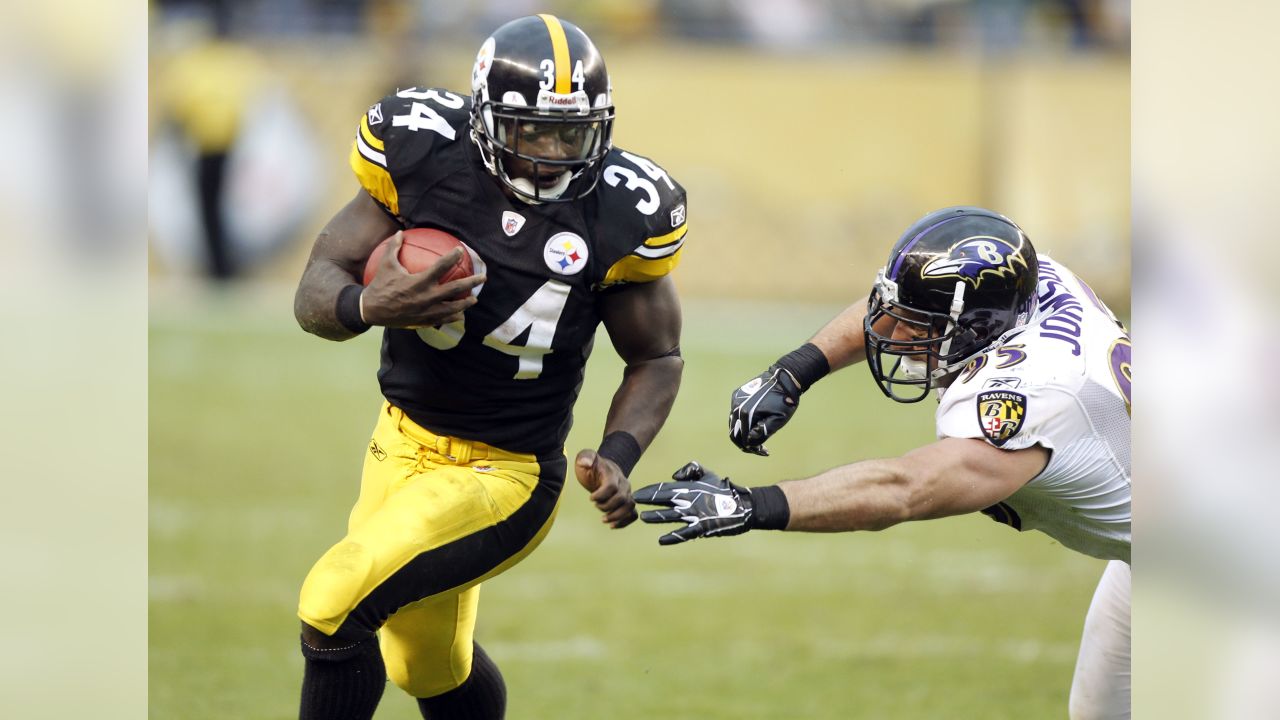 Pittsburgh Steelers running back Rashard Mendenhall(34) is tackled by  Cleveland Browns safety T.J. Ward(43)