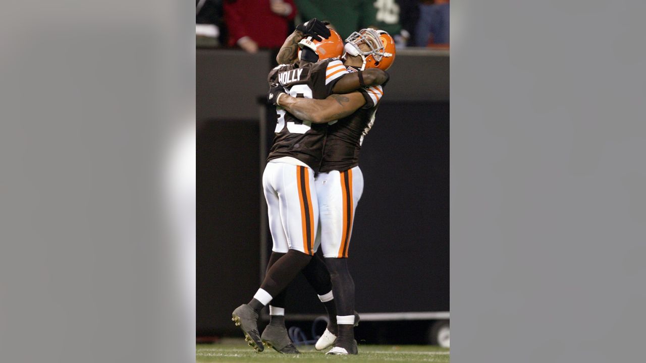 Cleveland Browns QB Charlie Frye (9) rolls out to pass against the