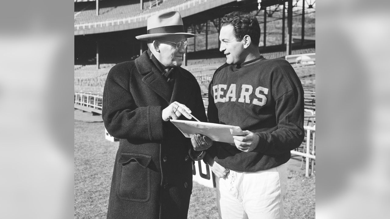 Red grange, backfield star , and George Halas, coach and onwer of