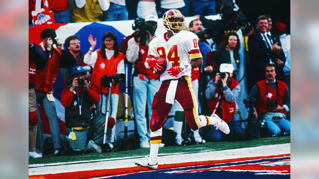 Washington Redskins cornerback Barry Wilburn (45) tries to stop Denver  Broncos Ricky Nattiel (84) from getting into the endzone after Nattiel  hauled in pass from quarterback John Elway during first quarter of