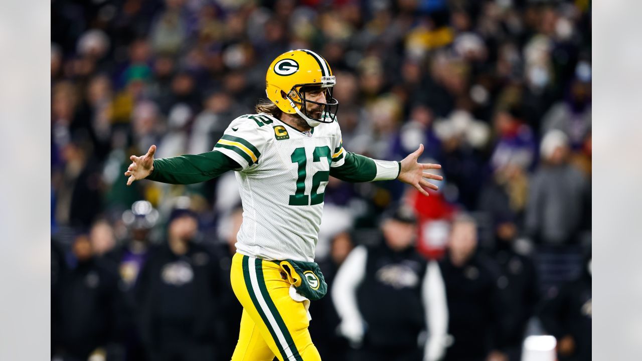 Green Bay Packers quarterback Aaron Rodgers (12) celebrates his