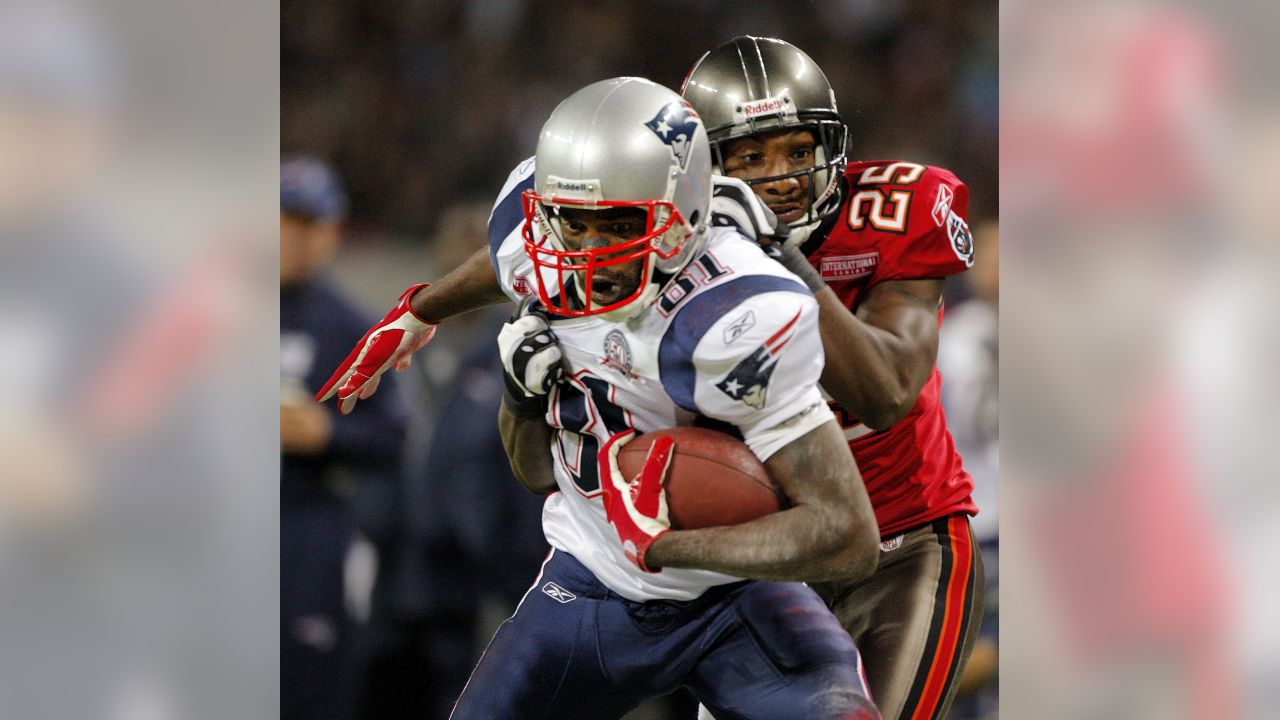 New England Patriots Brandon Meriweather reaches for the football as he  warms up for an NFL