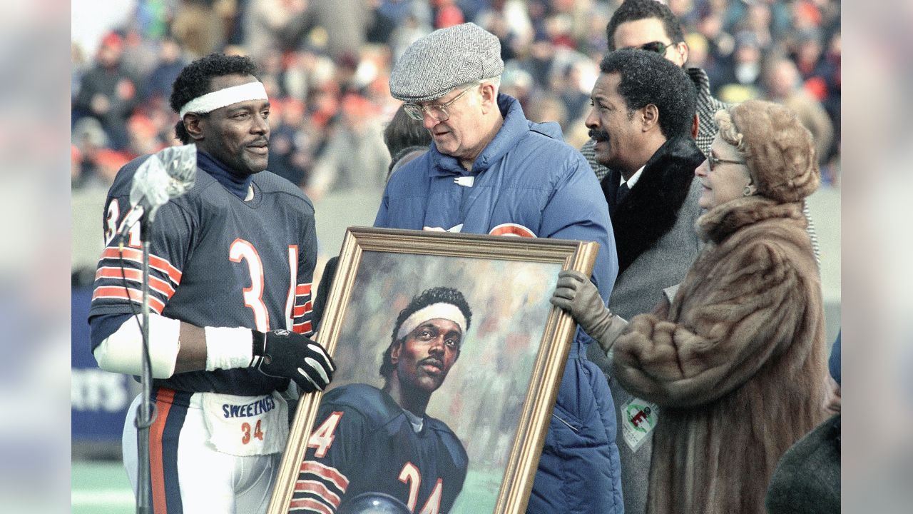 Standing infront of a wreath bearing Walter Payton's jersey number, Eddie  Payton, older brother of the late NFL Hall of Fame runningback Walter Payton,  thanks the audience attending Walter's memorial service Monday