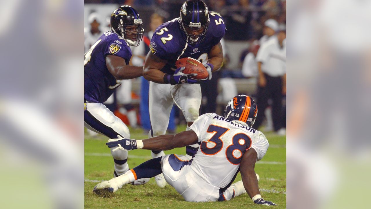 Photo: Ravens Todd Heap gains 4 yards against the Denver Broncos