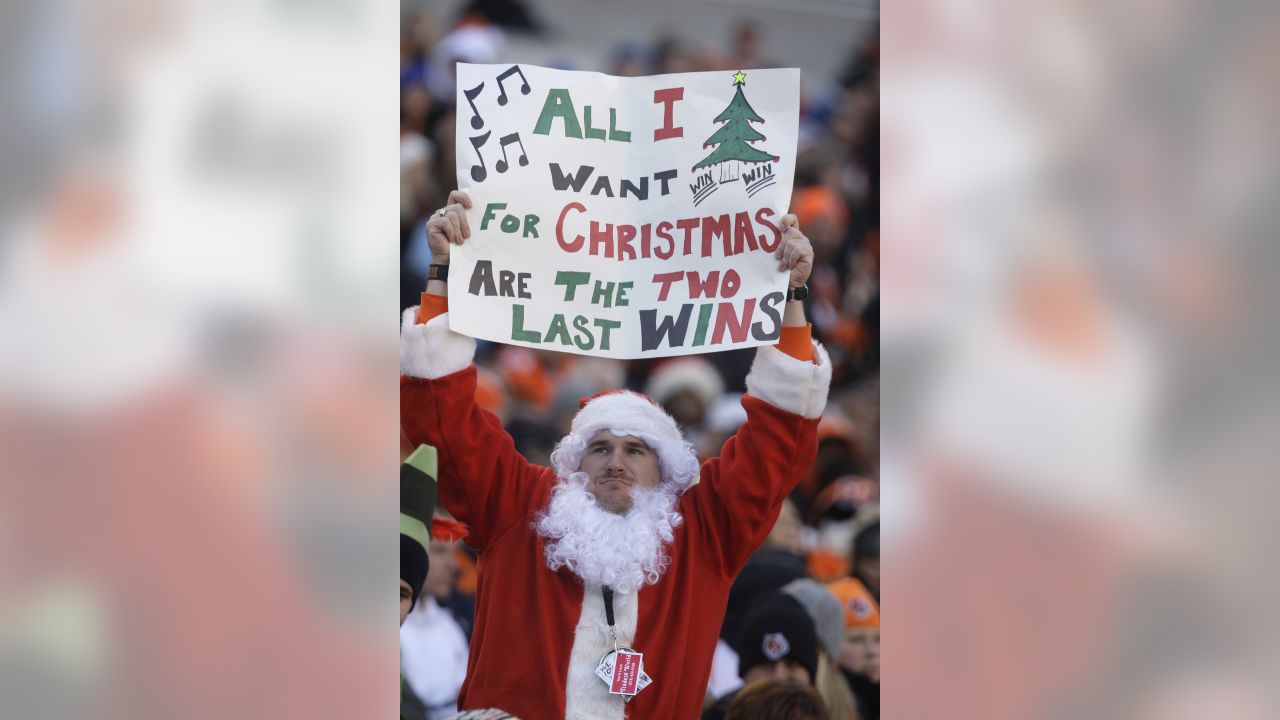 Jake Denooy of Fort Collins, Colo., places a Denver Broncos flag