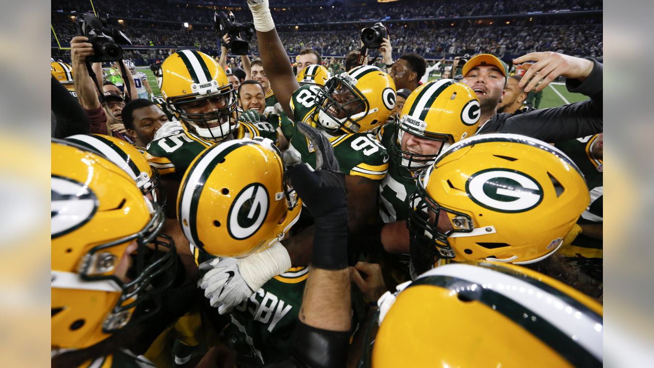 Green Bay Packers place kicker Mason Crosby (2) greets his