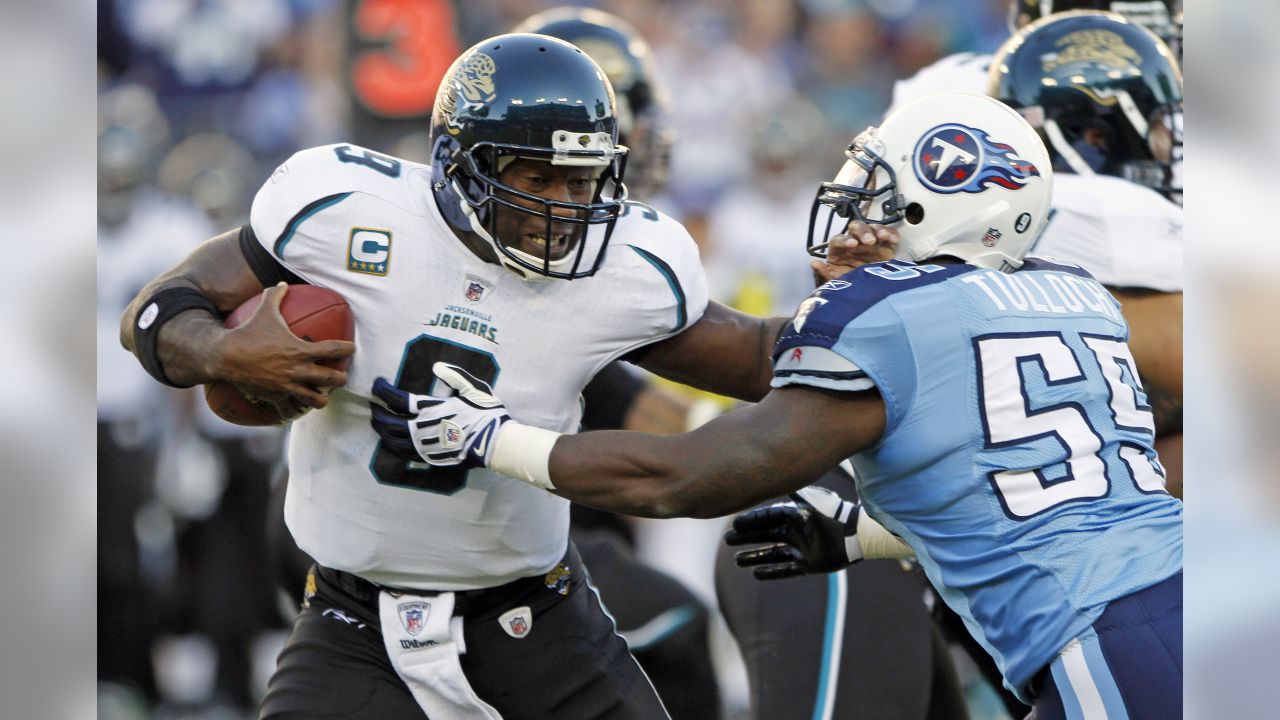 Tennessee Titans running back Chris Johnson (28) grabs the face mask of  Jacksonville Jaguars safety Gerald Alexander (42) in the first quarter of  an NFL football game in Nashville, Tenn., Sunday, Nov.