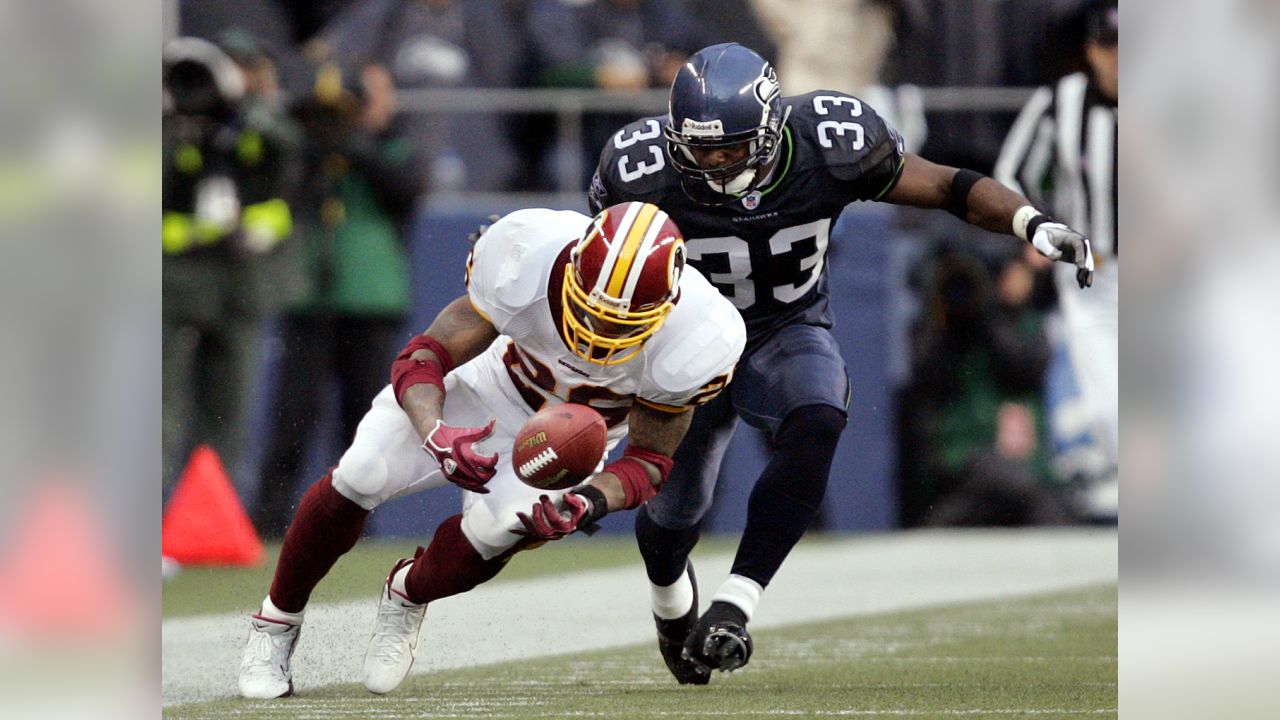 Seattle Seahawks wide receiver Darrell Jackson (82) celebrates in front of  Washington Redskins defensive back Ryan Clark, in back, after scoring a 29  yard touchdown in the second quarter during their NFC