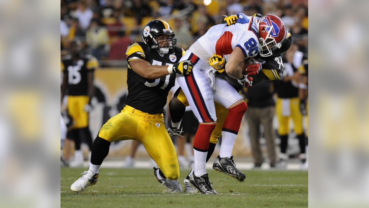 Pittsburgh Steelers wide receiver Limas Sweed, top, is tackled by Buffalo  Bills linebacker Paul Posluszny after maiking a catch for a first down in  the first quarter of the pre-season football game