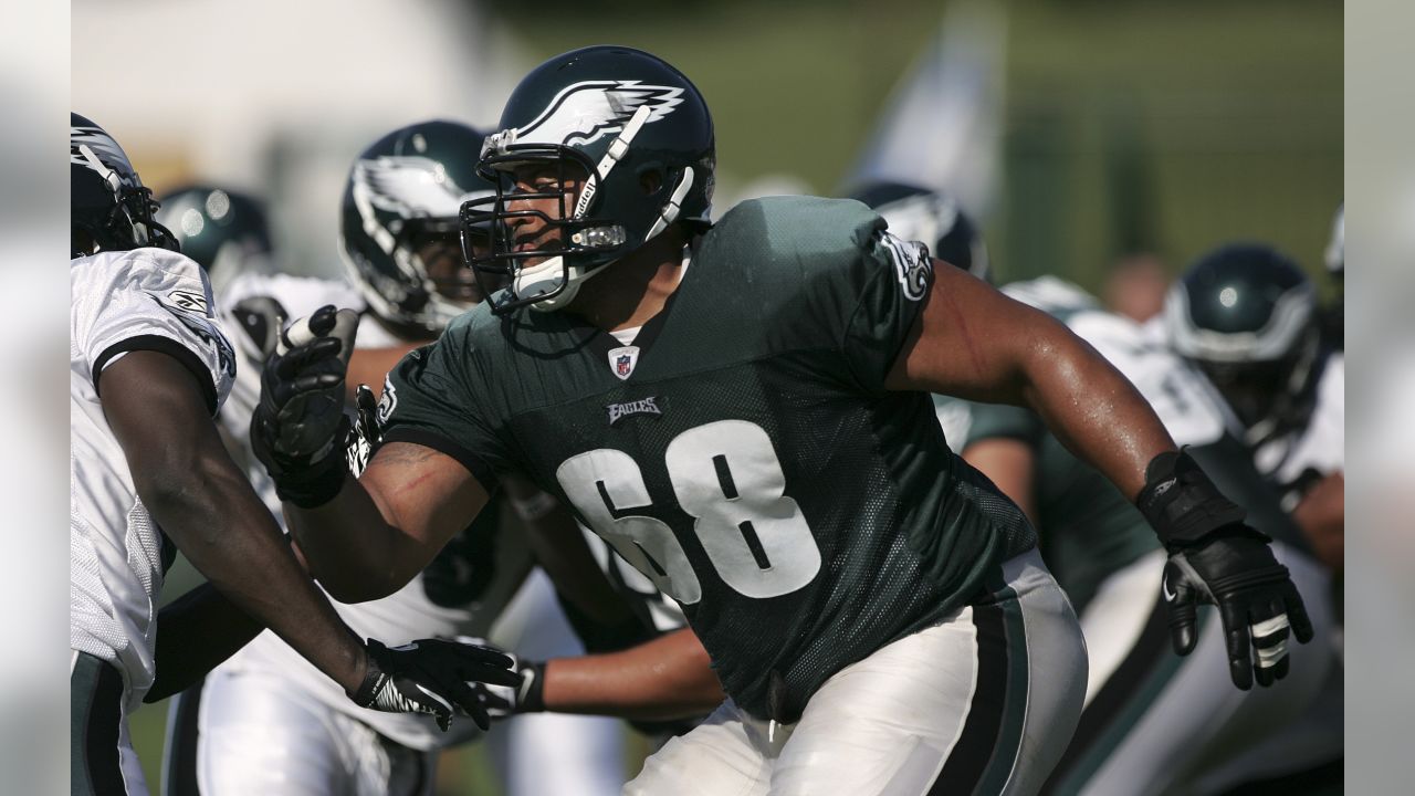 Philadelphia Eagles quarterback Michael Vick's daughter Jada Vick, 6, left,  plays with her father's helmet and her sister London Vick, 3, after an NFL  football training camp practice at Lehigh University Friday