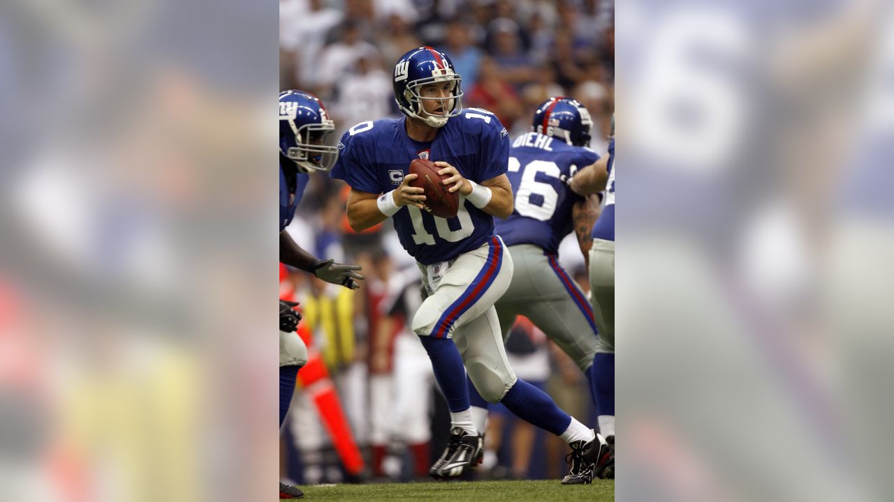 New York Giants Eli Manning celebrates after Plaxico Burress catches a 9  yard touchdown pass in the second quarter against the Philadelphia Eagles  at Giants Stadium in East Rutherford, New Jersey on