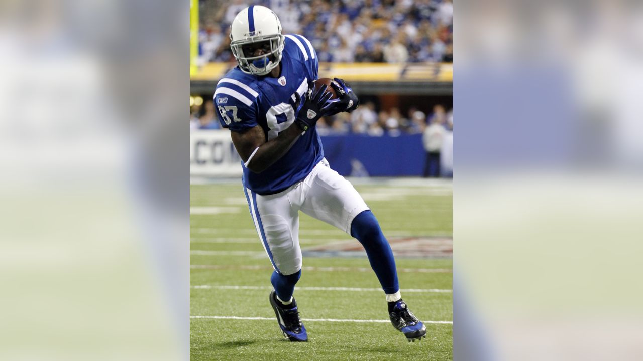 Running back Joseph Addai poses with his jersey after being