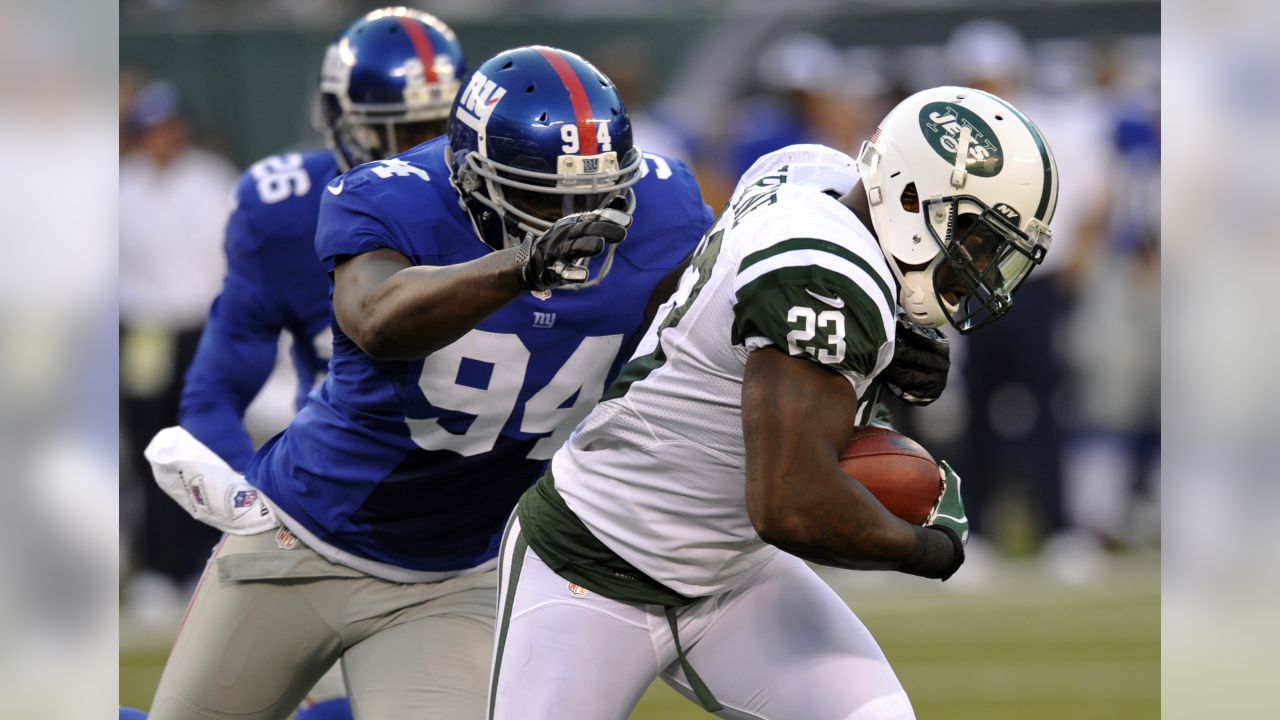 New York Jets Mark Sanchez gets sacked for 9 yards by New York Giants  Mathias Kiwanuka in the first quarter of a preseason game at Giants Stadium  in East Rutherford, New Jersey