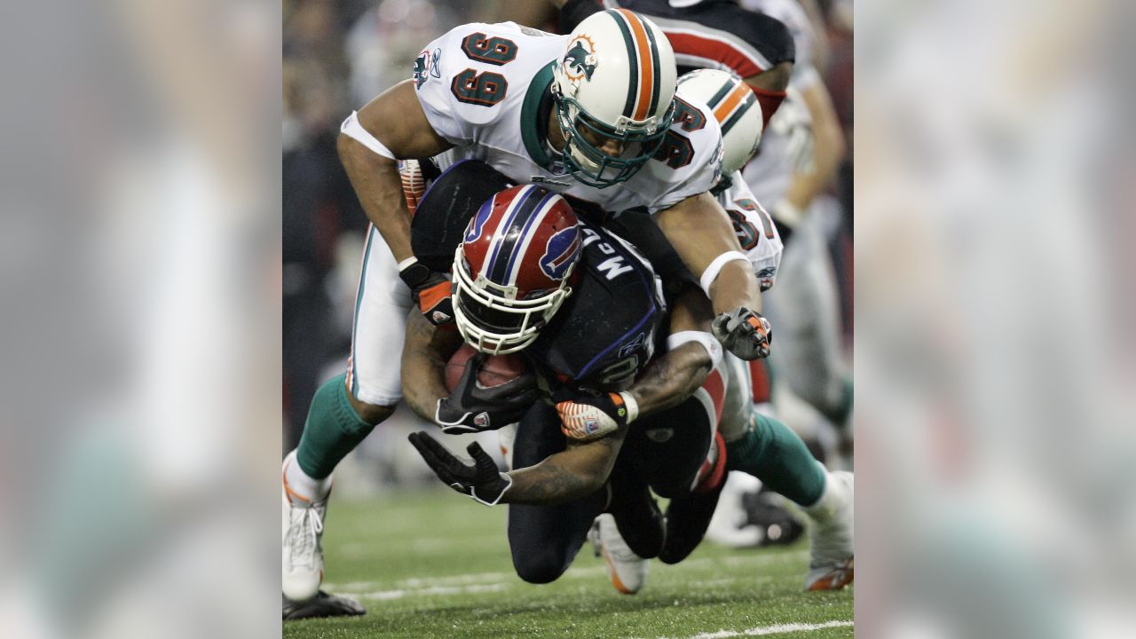 Miami Dolphins wide receiver Brandon Marshall (19) is tackled by Buffalo  Bills Drayton Florence (29) during first half action against The Buffalo  Bills at Sun Life Stadium, in Miami Florida.December 19,2010. The