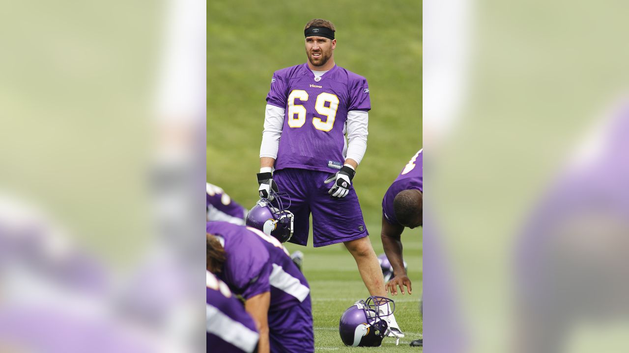 Minnesota Vikings kicker Rhys Lloyd struggles to put on his helmet