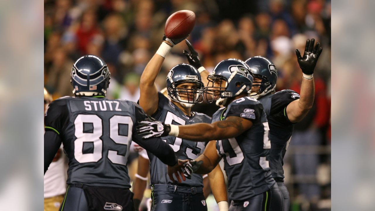 Seattle Seahawks' Maurice Morris steps from the grasp of San Francisco  49ers' Patrick Willis during the second quarter of their football game in  Seattle, Monday, Nov. 12, 2007. The Seahawks won 24-0