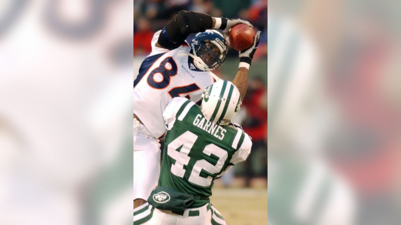 Denver Broncos tight end Shannon Sharpe leaves the field January 4