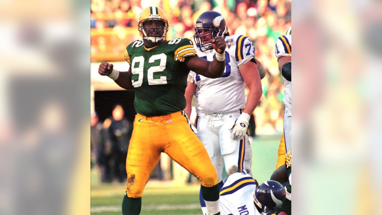 FILE - In this Sunday, Jan. 12, 1997, file photo, Green Bay Packers  defensive end Reggie White celebrates in the closing minutes of the NFC  Championship game against the Carolina Panthers at