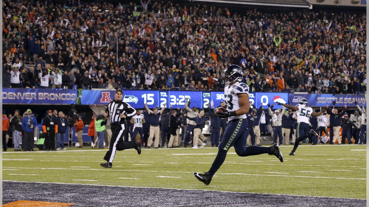 Seattle Seahawks outside linebacker Malcolm Smith (53) and cornerback Byron  Maxwell (41) celebrate a touchdown during the first half against the Denver  Broncos in Super Bowl XLVIII at MetLife Stad …