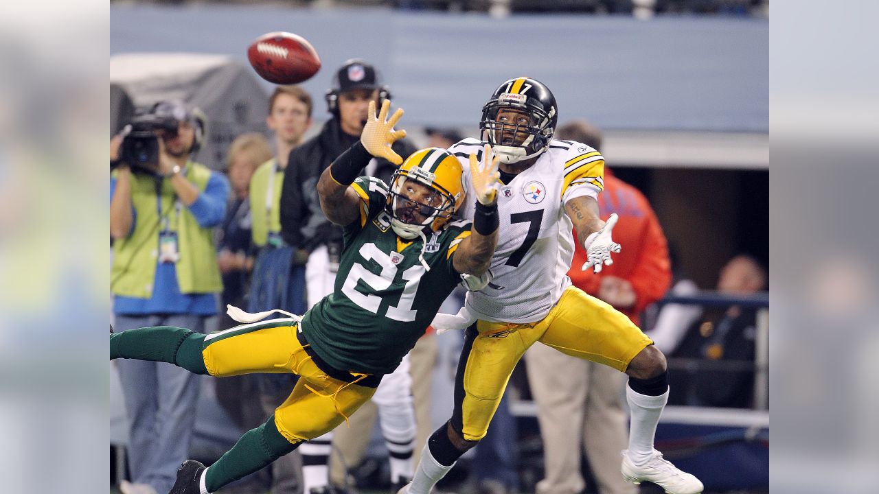 Green Bay Packers cornerback Charles Woodson breaks up a pass intended for  Pittsburgh Steelers wide receiver Mike Wallace in the second quarter during  Super Bowl XLV at Cowboys Stadium in Arlington, Texas