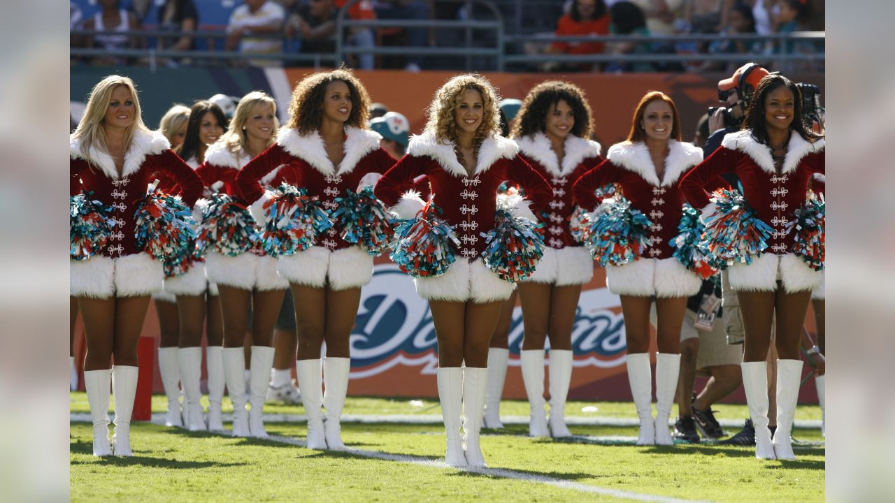 Carolina Panthers' Top Cats dance in their Santa outfits during the first  half of an NFL football game against the Arizona Cardinals in Charlotte,  N.C., Sunday, Dec.19, 2010. (AP Photo/Rick Havner Stock