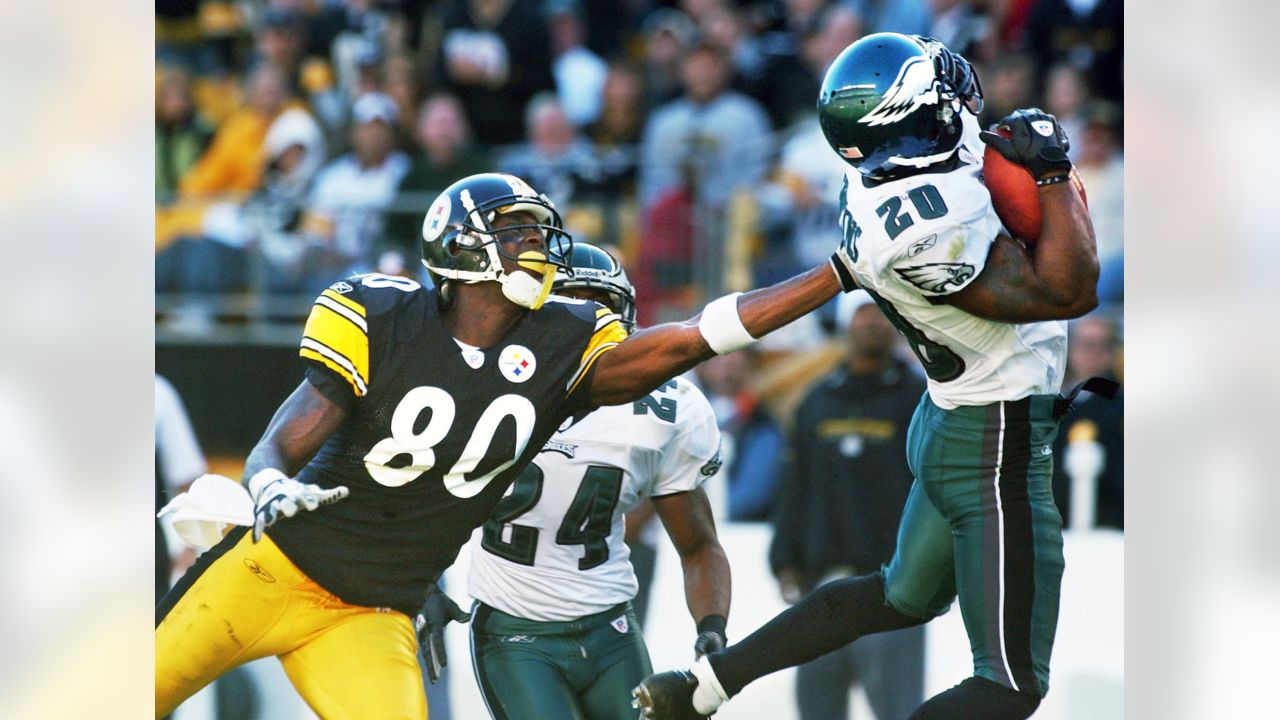 Philadelphia Eagles Brian Dawkins makes an interception over New York  Giants Plaxico Burress in the 2nd quarter at Giants Stadium in East  Rutherford, New Jersey on December 17, 2006. The New York