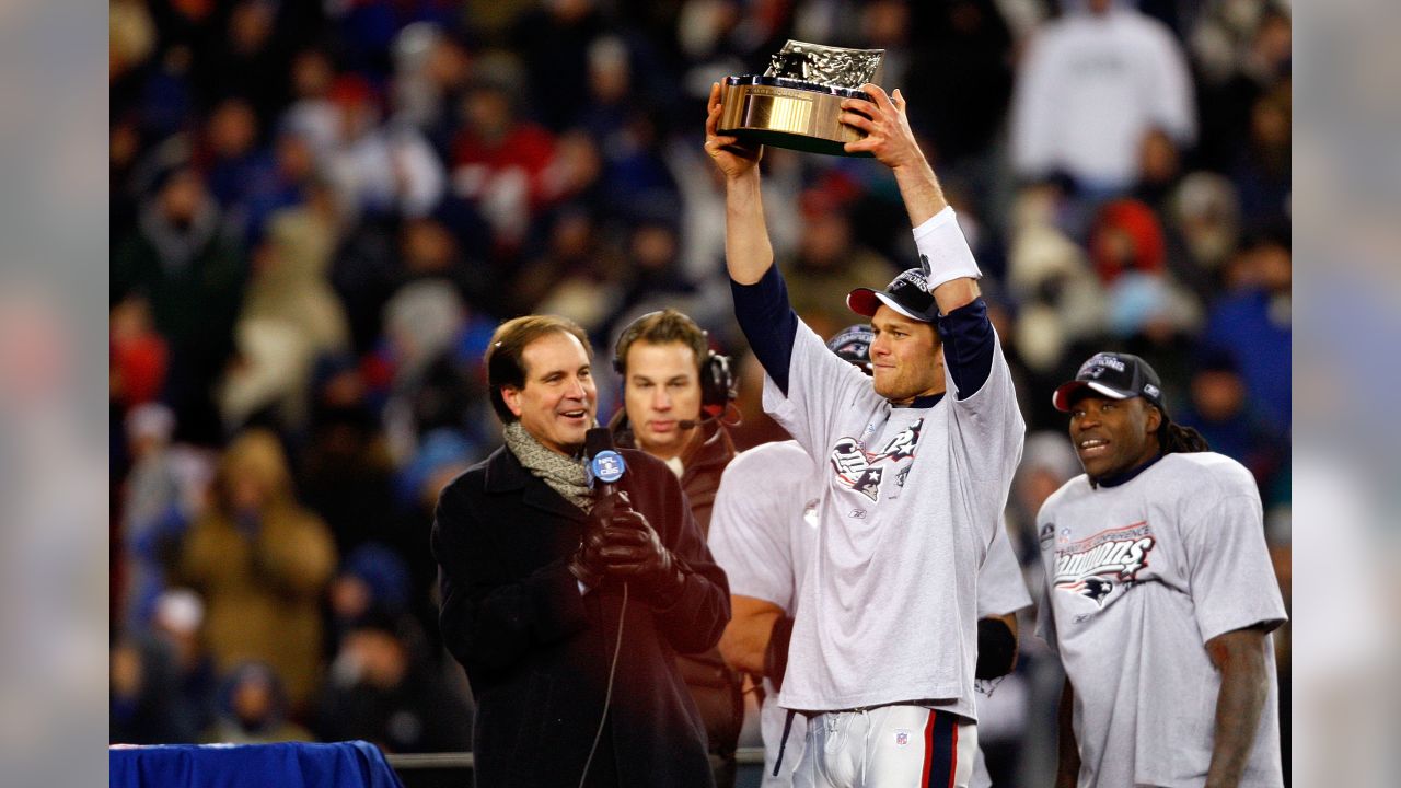 New England Patriots Junior Seau smiles while holding up the Lamar Hunt  trophy after the AFC Championship game against the San Diego Chargers at  Gillette Stadium in Foxboro Massachusetts on January 20